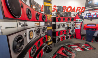 A showroom with various car audio speakers