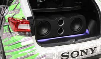 A SONY subwoofer enclosure in a trunk of a vehicle