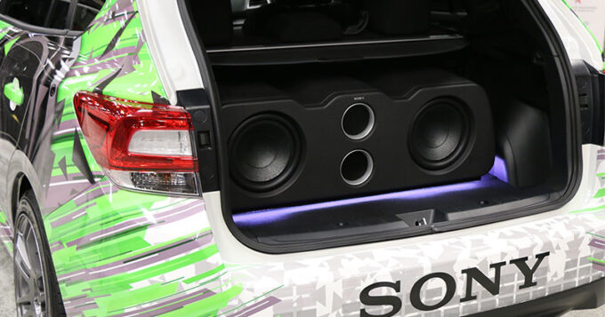 A SONY subwoofer enclosure in a trunk of a vehicle