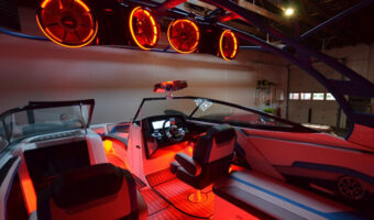 A boat with cool LED lighting upgrades in a garage