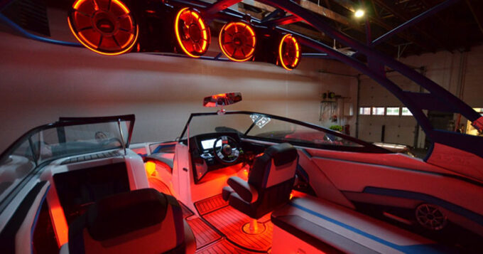 A boat with cool LED lighting upgrades in a garage