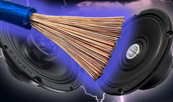 Two car audio speakers and an exposed wire cable